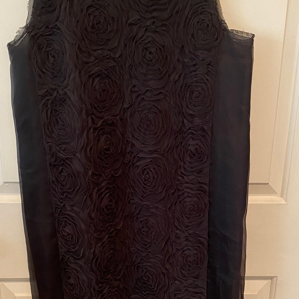 Charcoal sleeveless cocktail dress with silk lining and rose netting.